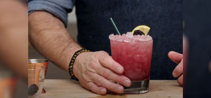 Bartender Making Fruity Blackberry Bramble Cocktail