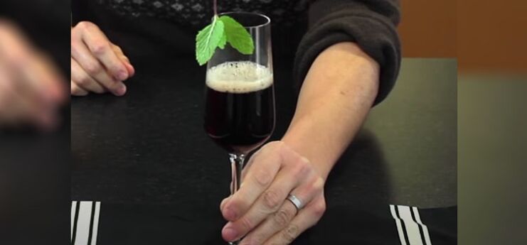 Man Holding Glass of Kir Royale