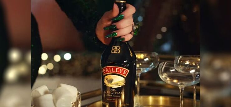 Woman Holding Bottle of Bailey's Irish Cream