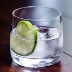 Ti’ Punch in a rocks glass with ice cubes and a lime wheel