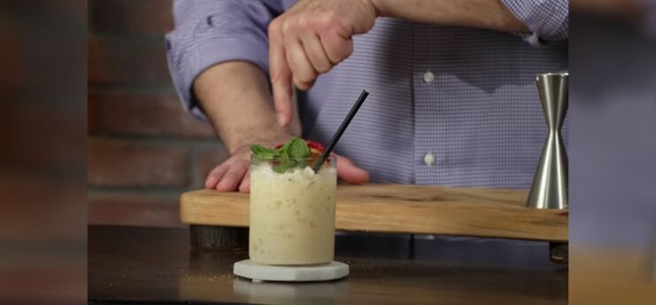 Bartender Making Painkiller Cocktail 